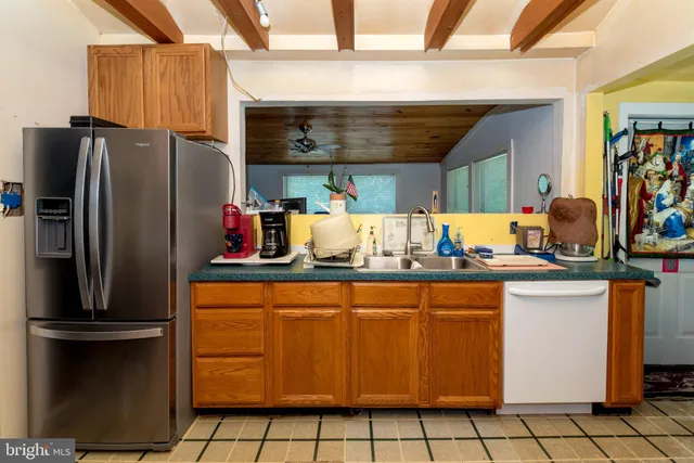 a bathroom with a sink a mirror and a window