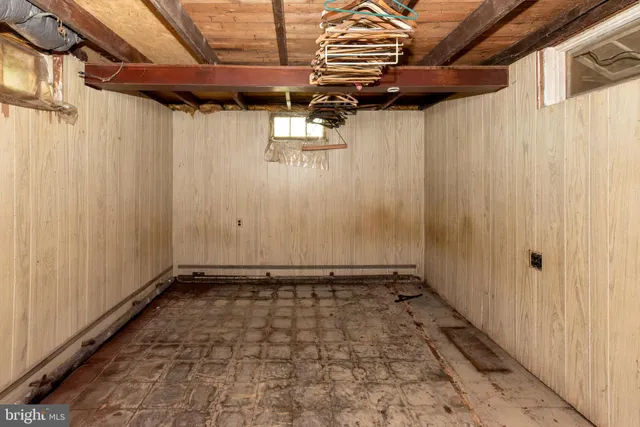 an aerial view of a house with lake view and a trees