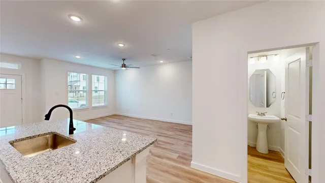 a kitchen with a sink and natural light