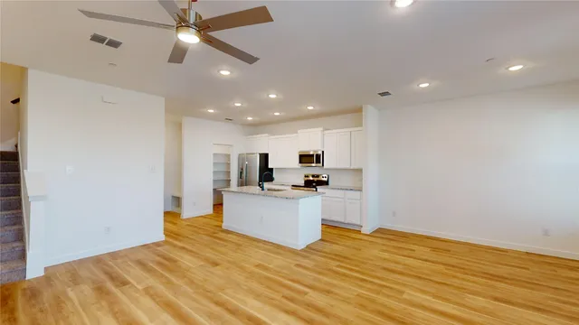 a view of kitchen and wooden floor