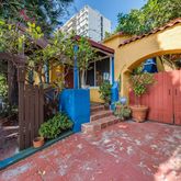 a view of a backyard with sitting area