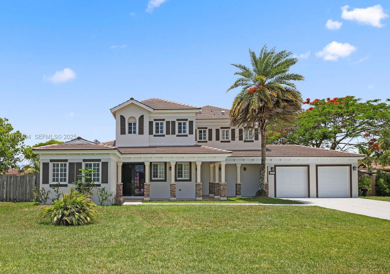 a front view of a house with a garden