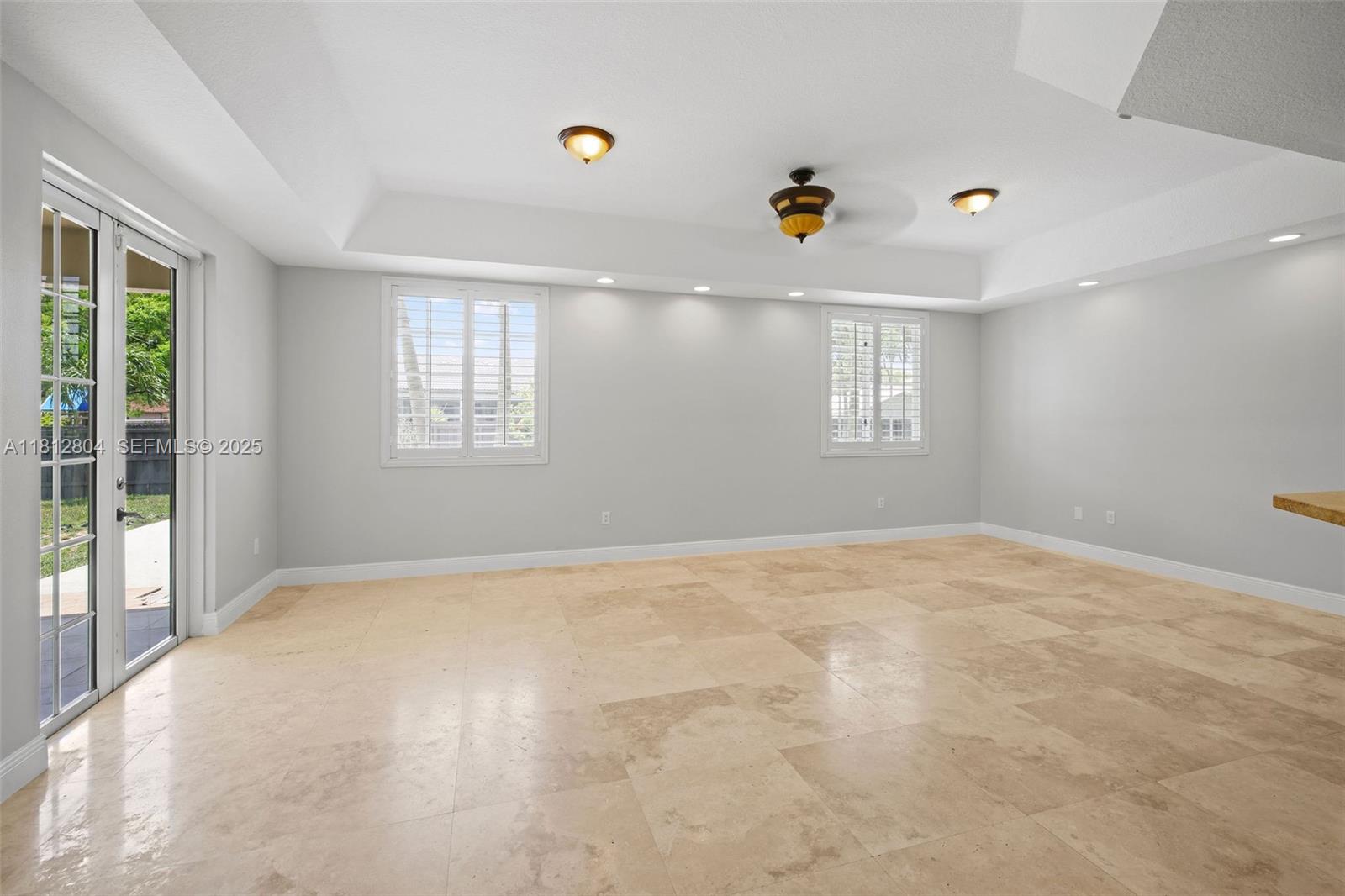 32360 Southwest 204th Avenue Homestead, FL 33030 - Photo 13 of 44 an empty room with windows and natural light