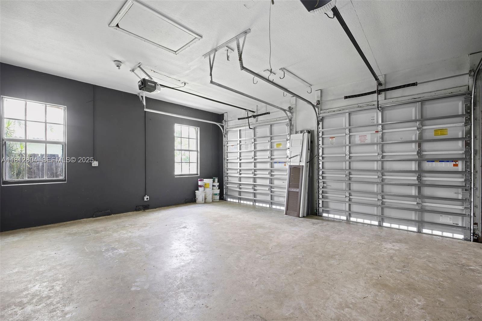 32360 Southwest 204th Avenue Homestead, FL 33030 - Photo 19 of 44 a view of empty room with windows