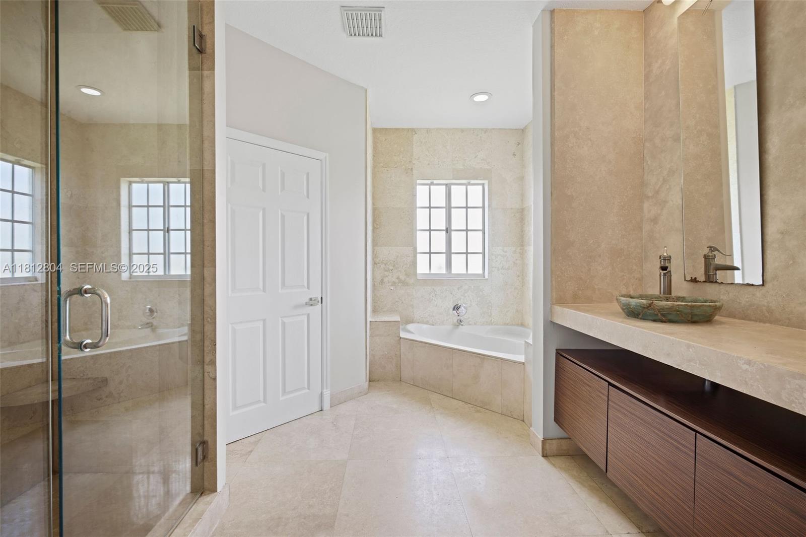 32360 Southwest 204th Avenue Homestead, FL 33030 - Photo 25 of 44 a bathroom with a granite countertop sink a toilet and shower