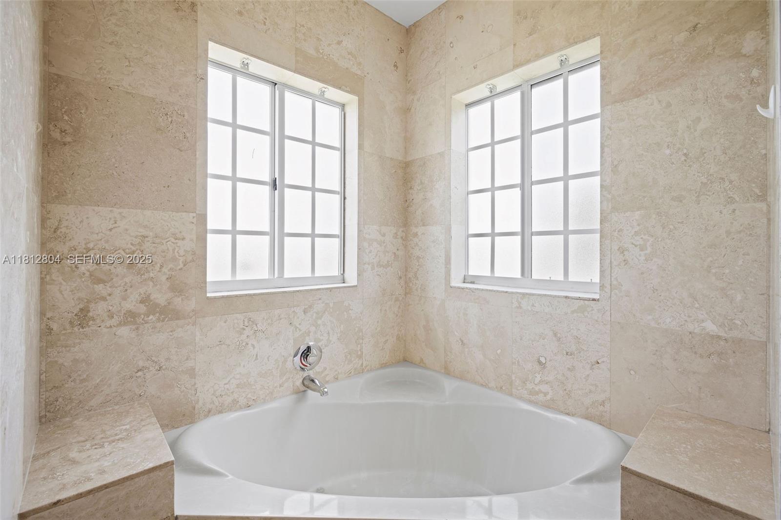 32360 Southwest 204th Avenue Homestead, FL 33030 - Photo 26 of 44 a white bath tub sitting in a bathroom next to a window