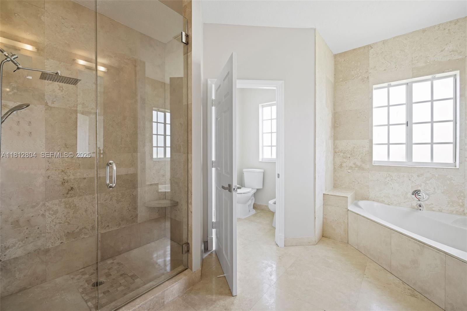 32360 Southwest 204th Avenue Homestead, FL 33030 - Photo 27 of 44 a spacious bathroom with a shower and a bathtub