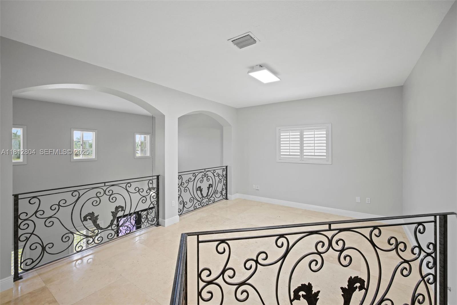 32360 Southwest 204th Avenue Homestead, FL 33030 - Photo 29 of 44 a view of a hallway with windows