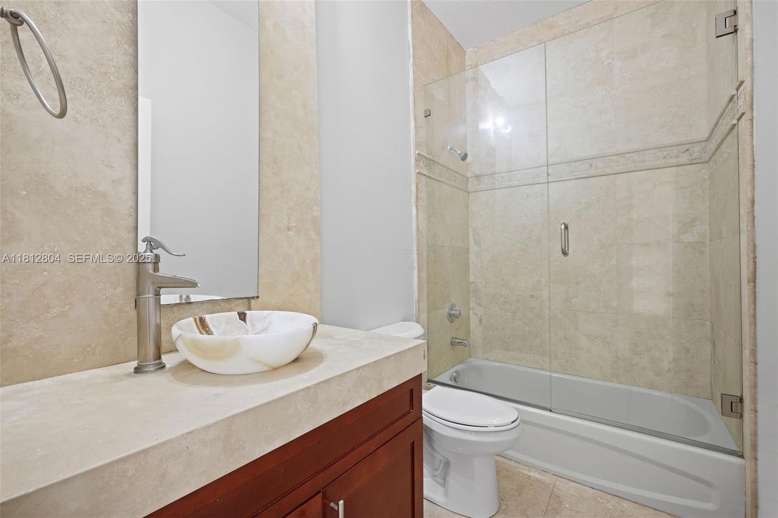 32360 Southwest 204th Avenue Homestead, FL 33030 - Photo 33 of 44 a bathroom with a sink a toilet and shower