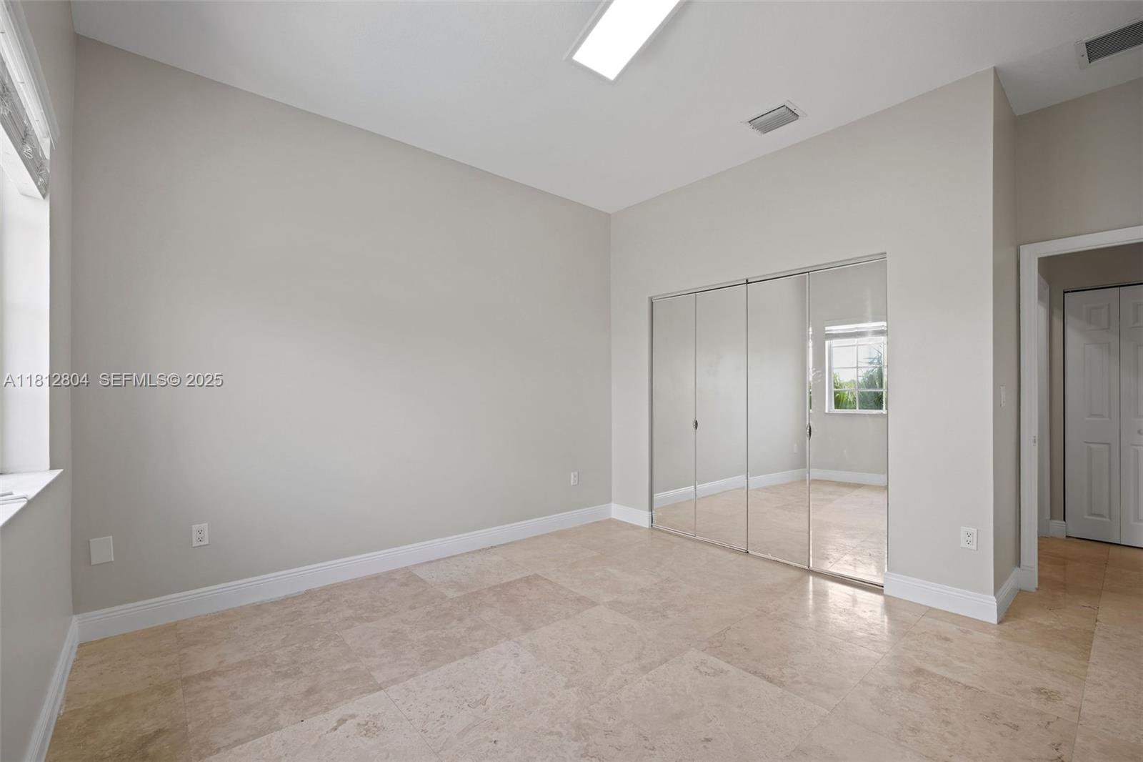 32360 Southwest 204th Avenue Homestead, FL 33030 - Photo 35 of 44 an empty room with mirror in it