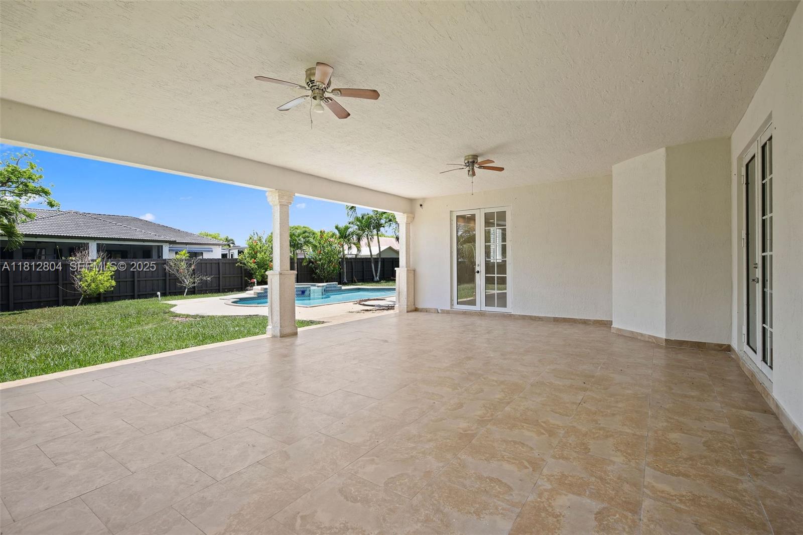 32360 Southwest 204th Avenue Homestead, FL 33030 - Photo 38 of 44 a view of a house with porch and a yard
