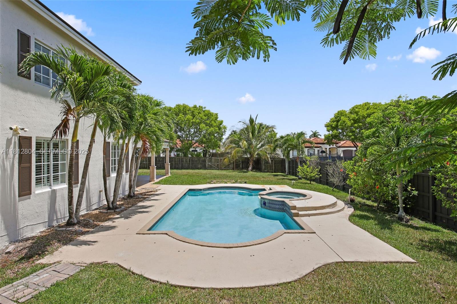 32360 Southwest 204th Avenue Homestead, FL 33030 - Photo 41 of 44 a view of a swimming pool with a yard