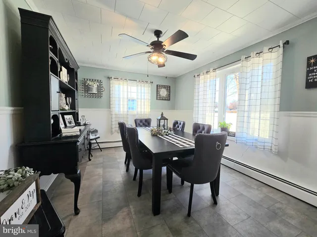 a bathroom with a granite countertop sink mirror and toilet