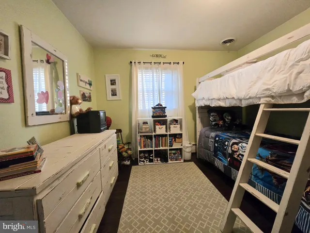 a view of small space with wooden floor and closet
