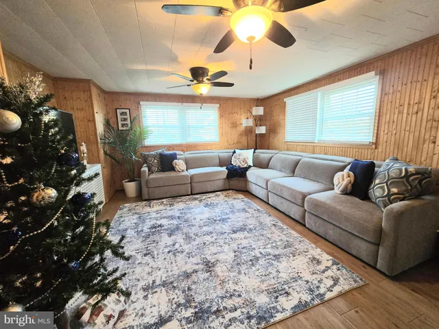 a view of a house with backyard porch and sitting area