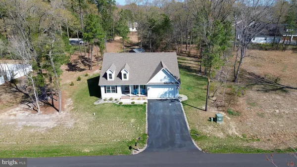 an aerial view of house with yard