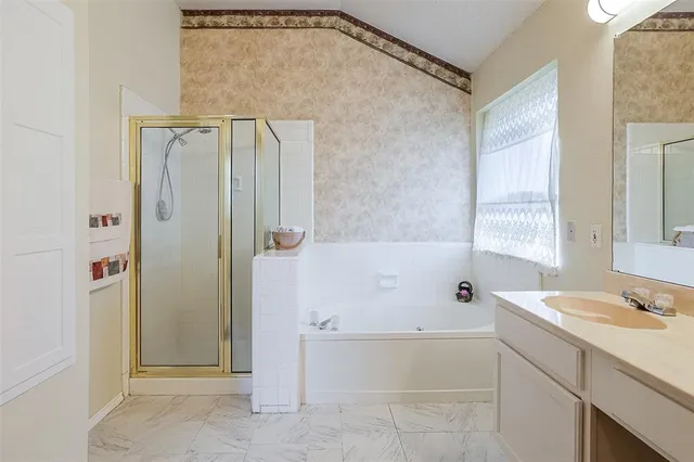 a bathroom with a bathtub and a sink
