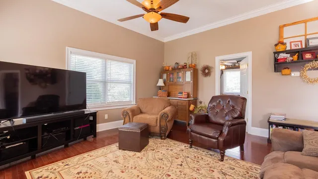 a living room with furniture and a window