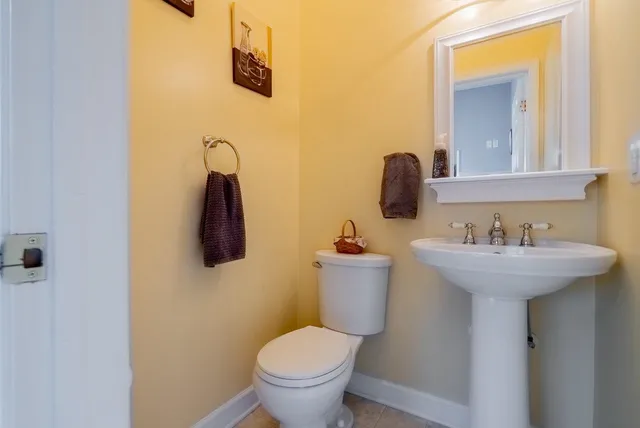 a bedroom with bed and window