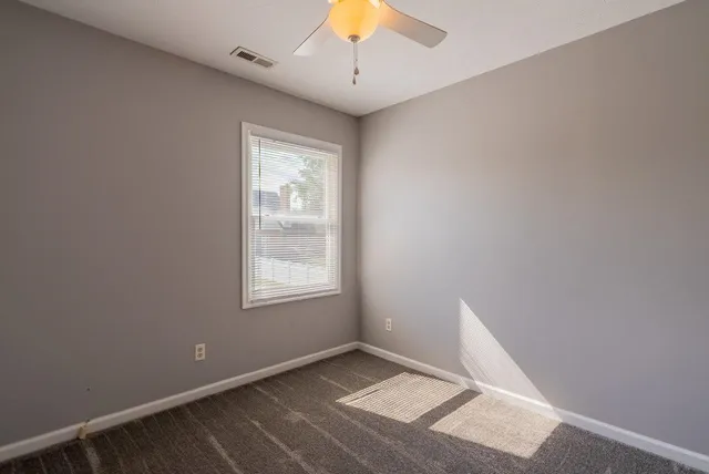a view of a bathroom with a shower curtain