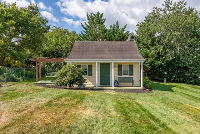 a backyard of a house with seating space