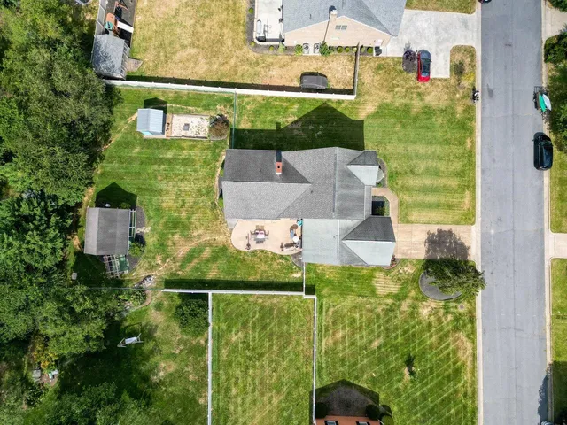 an aerial view of houses with outdoor space
