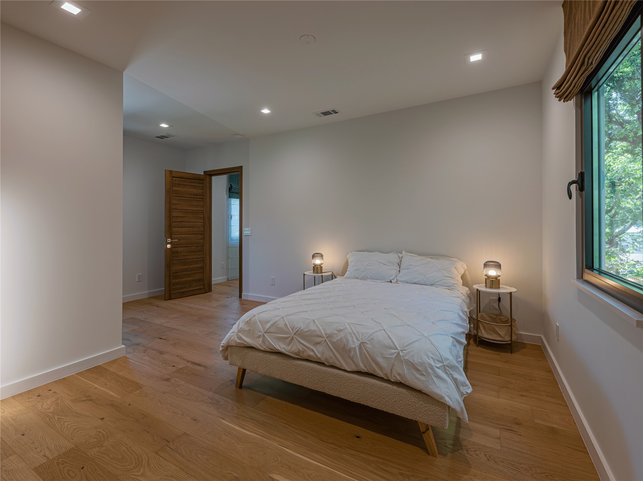 2806 Geronimo Trail Austin, TX 78734 - Photo 14 of 36 a bedroom with a bed and a window