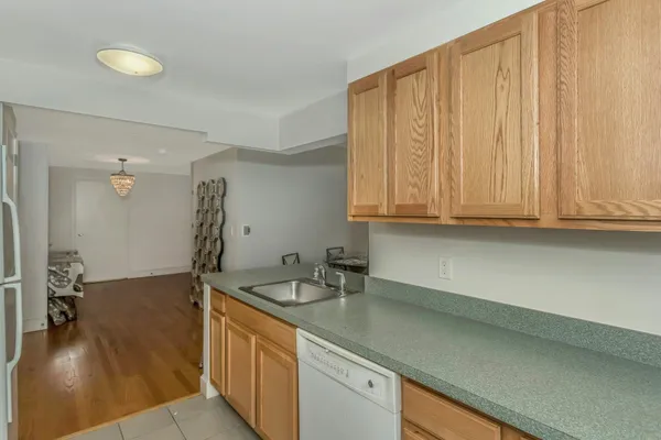 a kitchen with a sink and cabinets