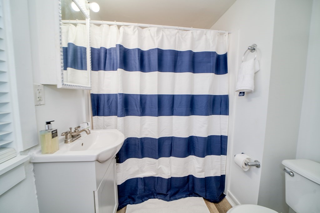 94 Sea Street, Unit B Barnstable, MA 02601 - Photo 4 of 6 a bathroom with a sink and a bathtub