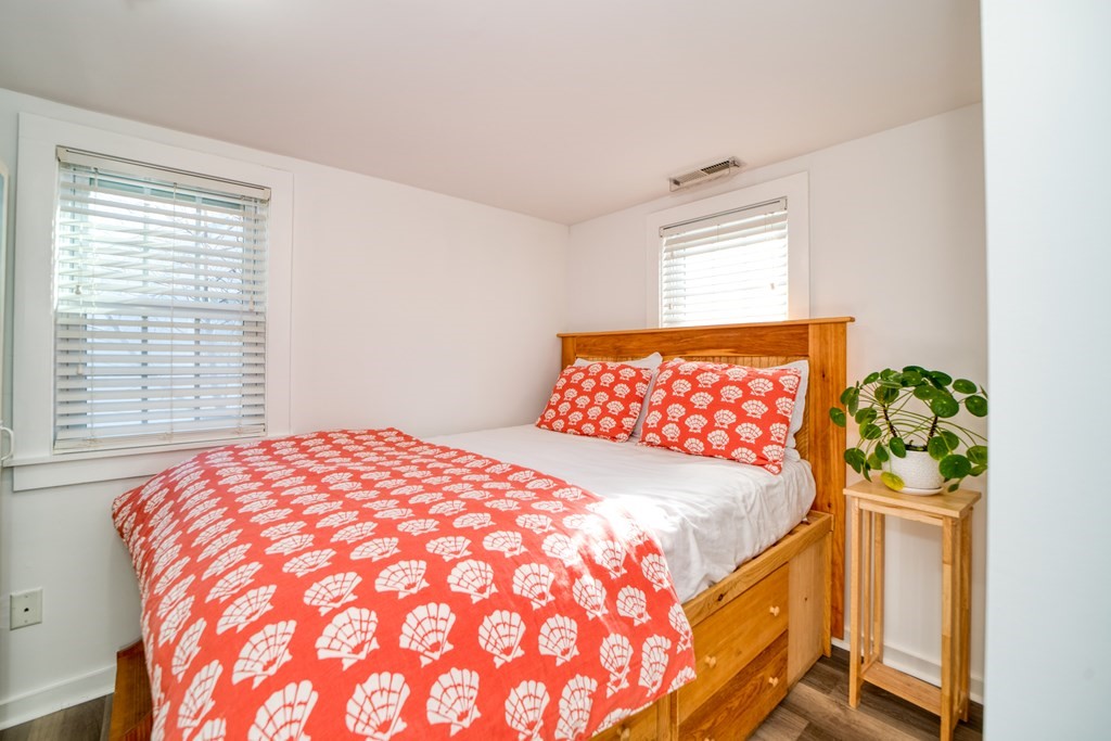 94 Sea Street, Unit B Barnstable, MA 02601 - Photo 5 of 6 a bedroom with a bed and window