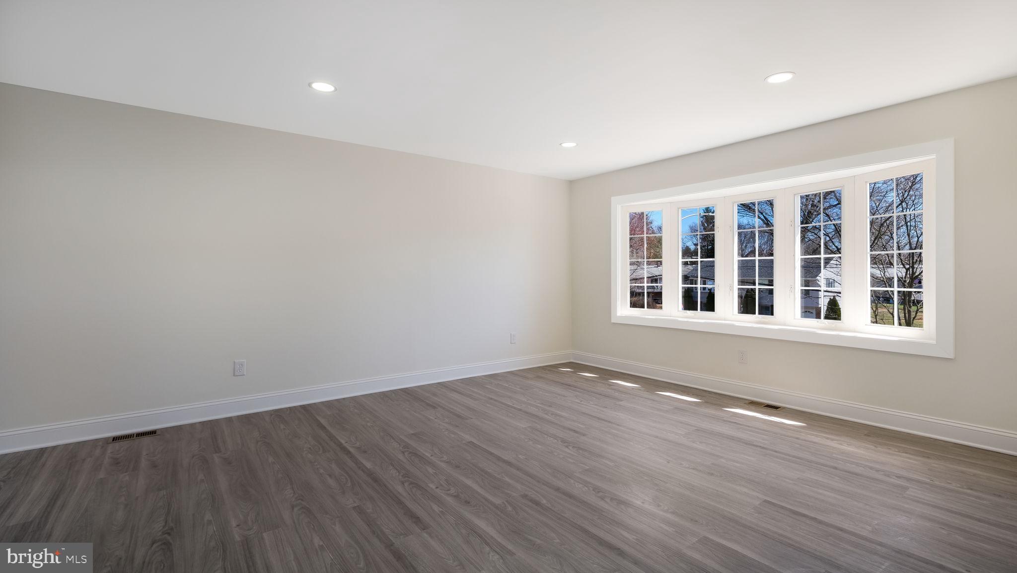 2330 Weir Road Aston, PA 19014 - Photo 14 of 39 a view of an empty room with wooden floor and a window