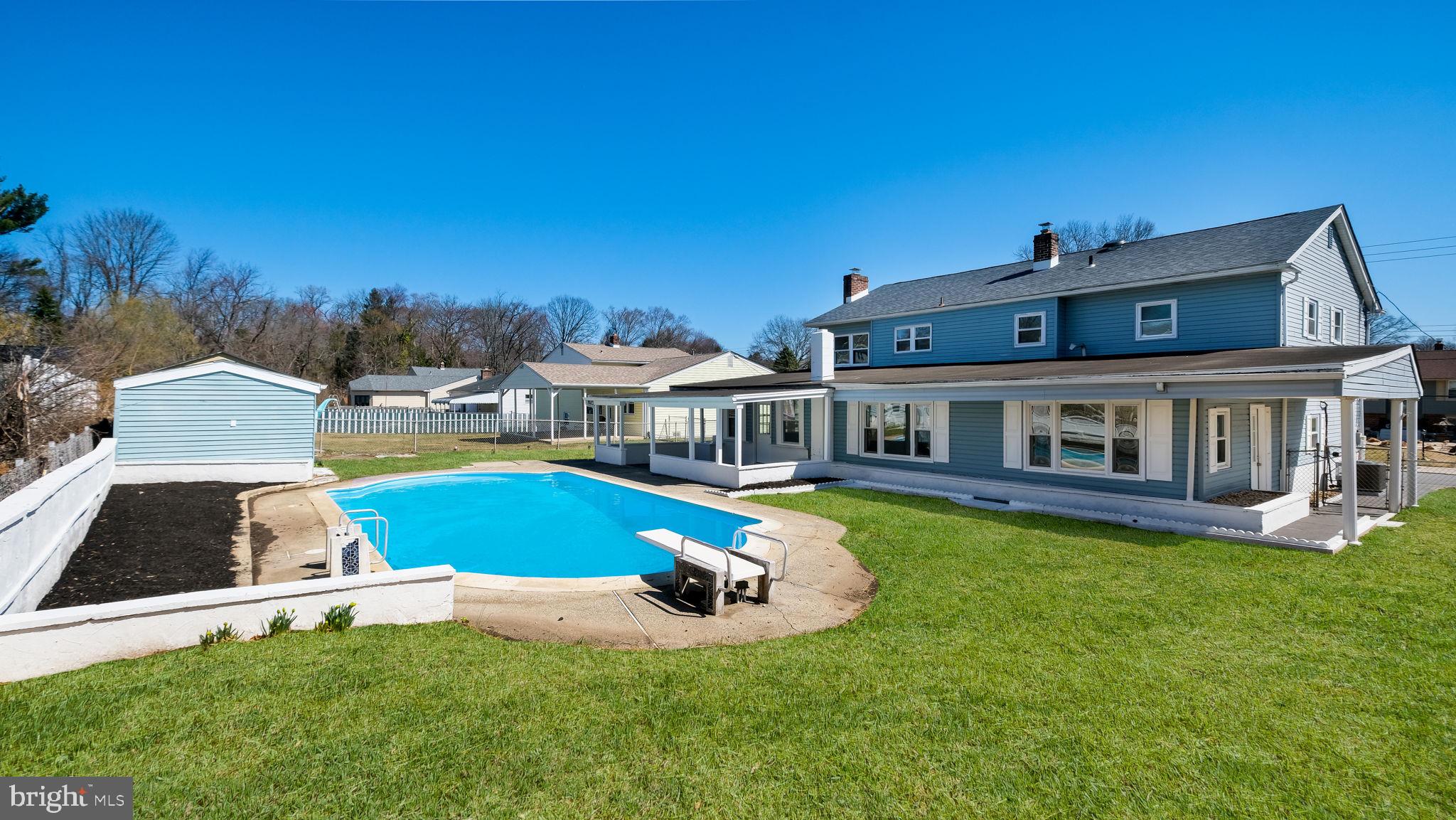 2330 Weir Road Aston, PA 19014 - Photo 17 of 39 a front view of house with yard and swimming pool