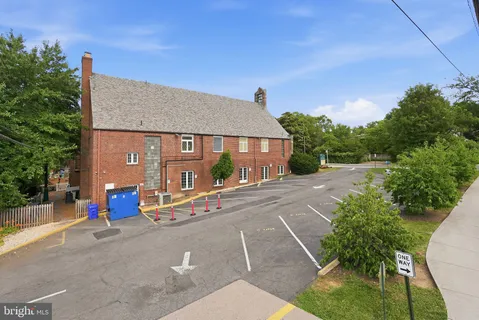 a view of a house with basketball court