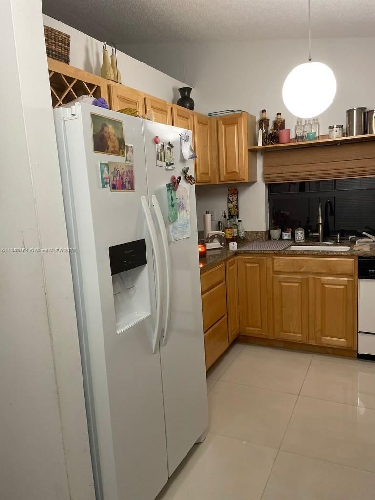 Kendall Miami, FL 33176 - Photo 3 of 9 a kitchen with cabinets a sink and appliances