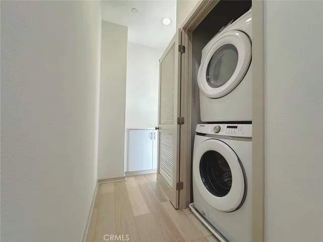 a view of a hallway with washer and dryer