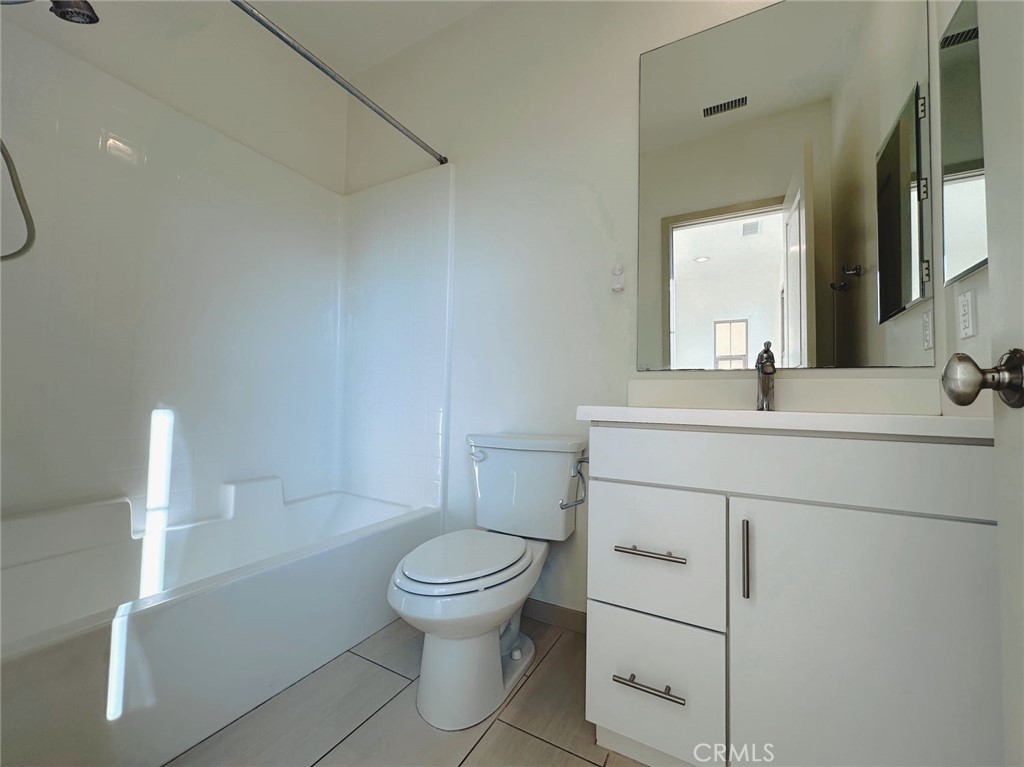 87 Evening Sun Irvine, CA 92620 - Photo 17 of 20 a bathroom with a sink toilet and mirror