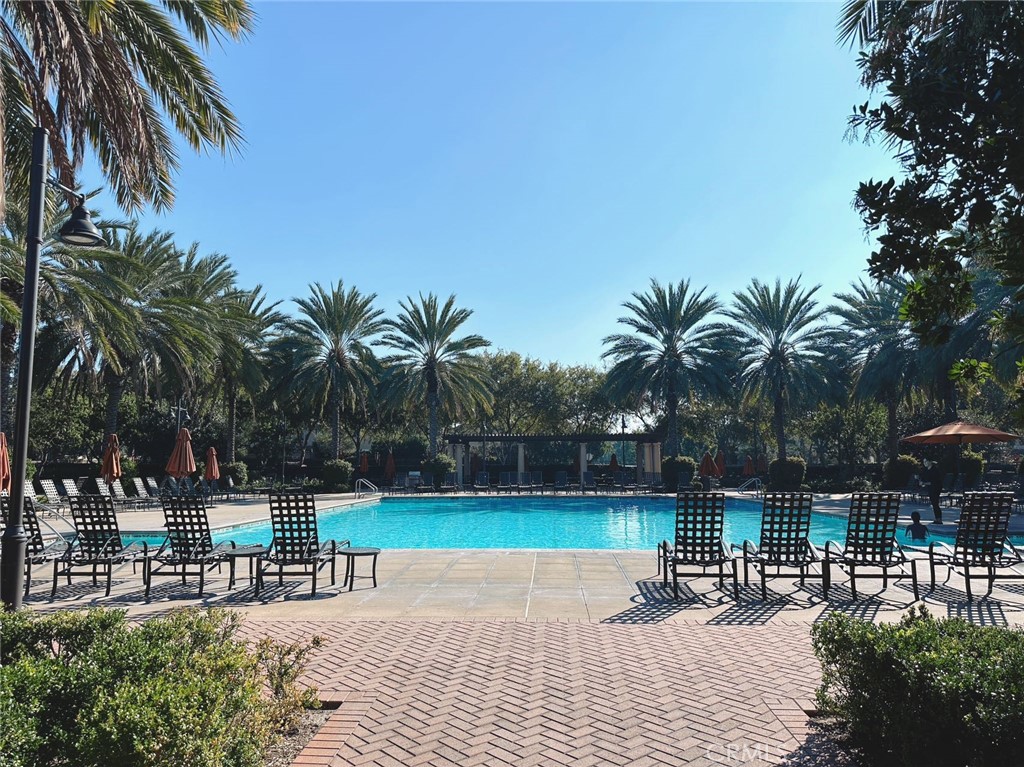 87 Evening Sun Irvine, CA 92620 - Photo 19 of 20 a swimming pool with outdoor seating and yard