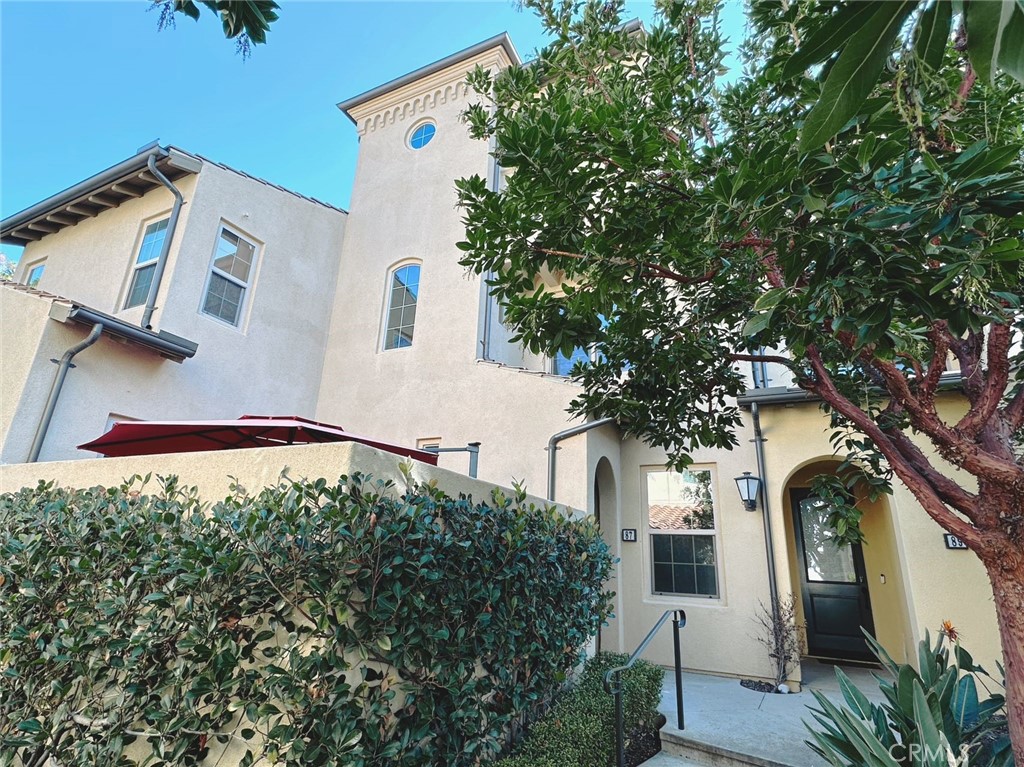 87 Evening Sun Irvine, CA 92620 - Photo 2 of 20 a view of a house with a tree