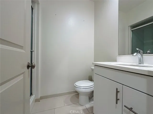 a bathroom with a sink toilet and vanity