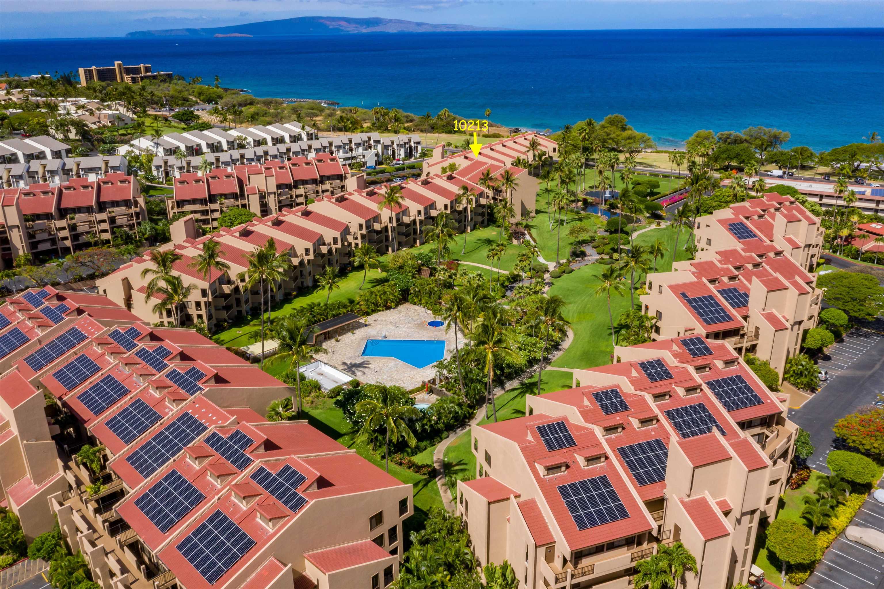2695 South Kihei Road, Unit 10213 Kihei, HI 96753 - Photo 1 of 37 a view of multiple houses with outdoor space