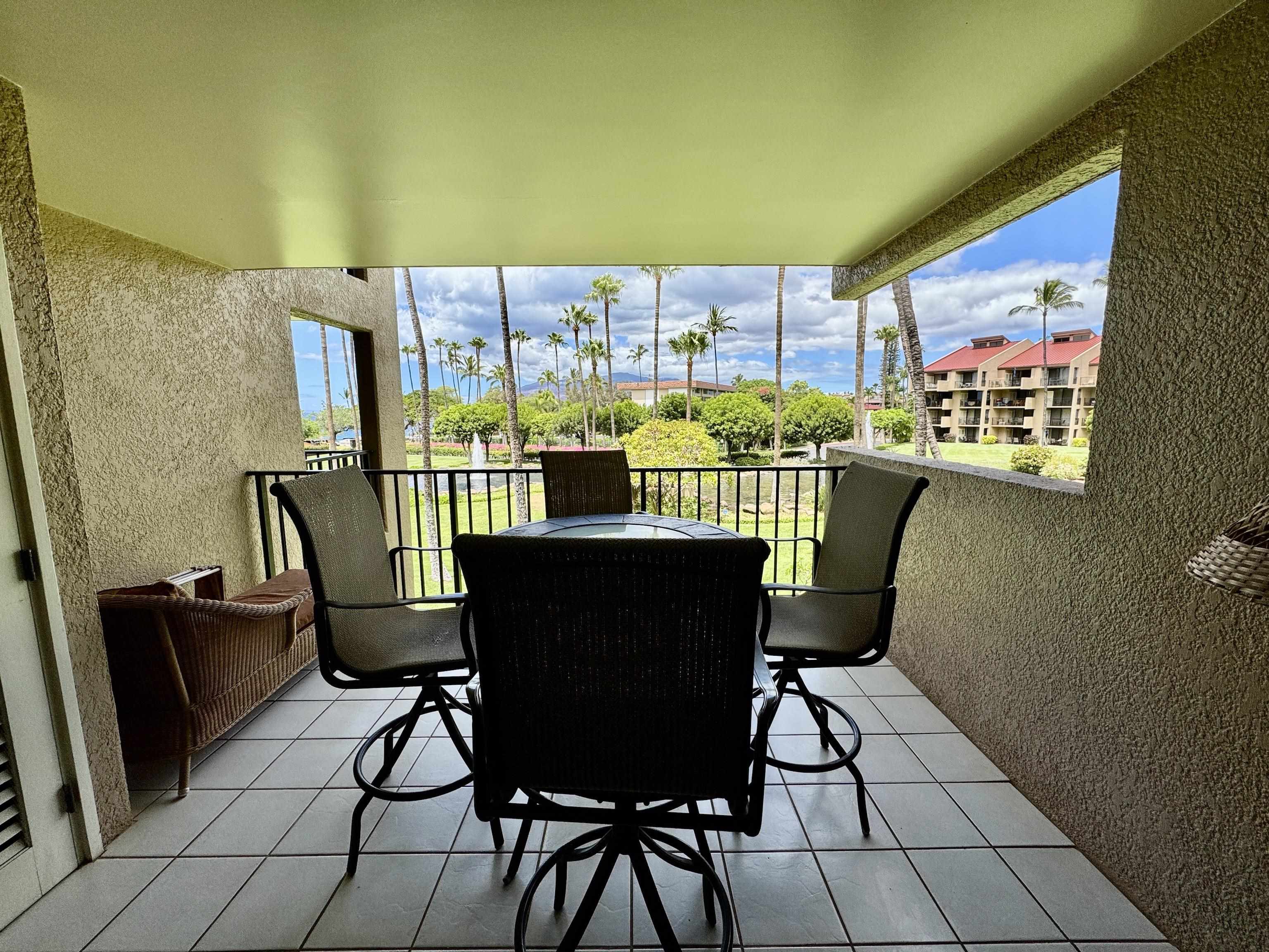 2695 South Kihei Road, Unit 10213 Kihei, HI 96753 - Photo 8 of 37 a view of a chairs and table in a balcony