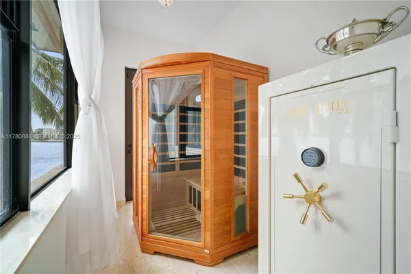 a view of a hallway with wooden floor and door