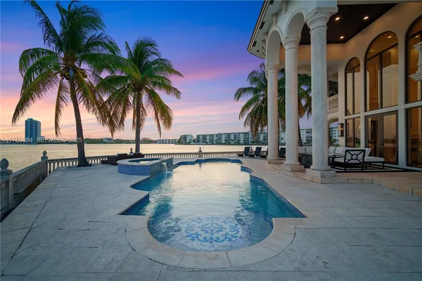 a view of a swimming pool and outdoor seating