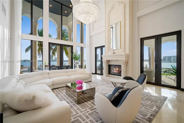 a living room with furniture fireplace and flat screen tv