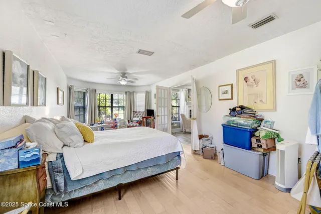 a bedroom with a bed couch and window