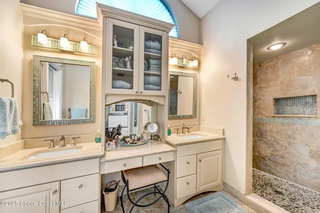 a bathroom with a sink double vanity and a mirror