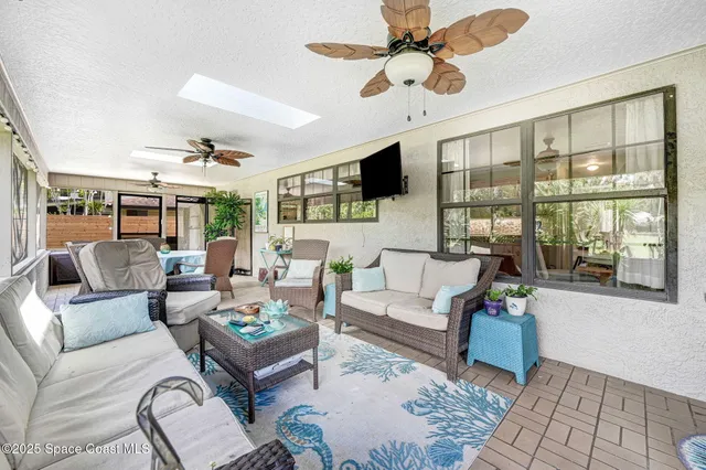 a living room with furniture or outdoor view and a flat screen tv