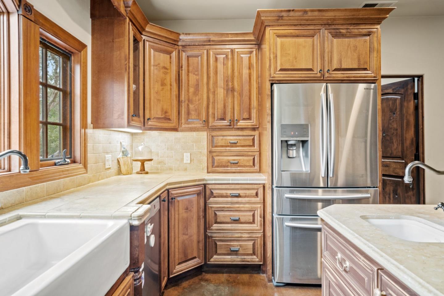17551 Pond Derosa Lane Prunedale, CA 93907 - Photo 12 of 63 a kitchen with stainless steel appliances granite countertop a refrigerator and a sink