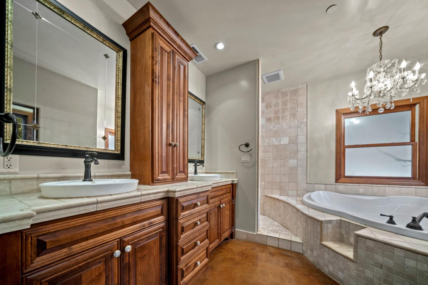 17551 Pond Derosa Lane Prunedale, CA 93907 - Photo 26 of 63 a bathroom with a double vanity sink and a bathtub