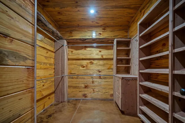 a bedroom with a bed and a table